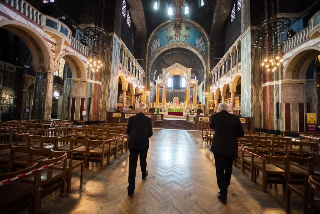 Cardinal and Archbishop Welby pray together on first day of church opening